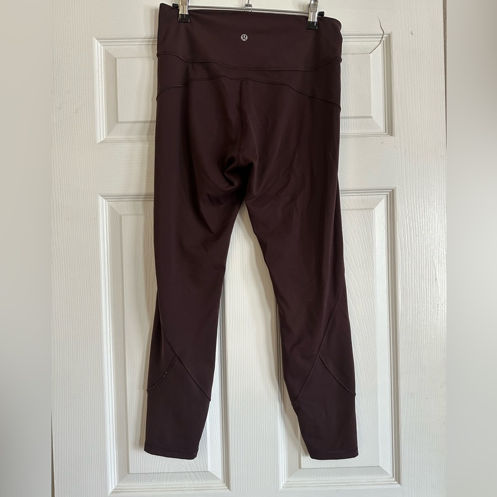 Women’s Fast and Free High-Rise Tight 25" Maroon, size 10.